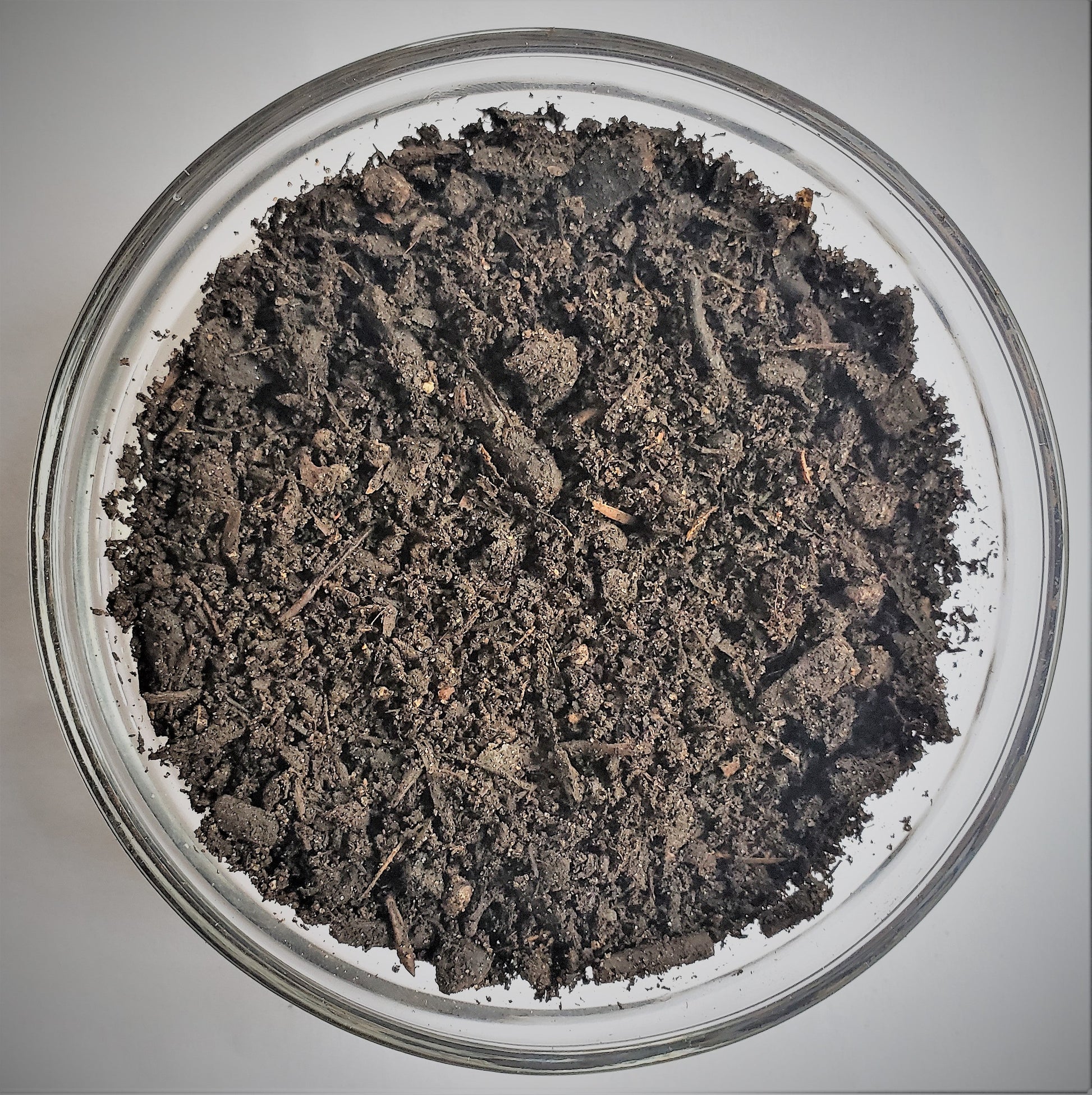 Close-up of The Soil Makers Elite Compost, a premium 100% organic compost made from composted organic materials to improve soil structure, support beneficial microorganisms, and promote healthy plant growth in raised beds, containers, and vegetable gardens.
